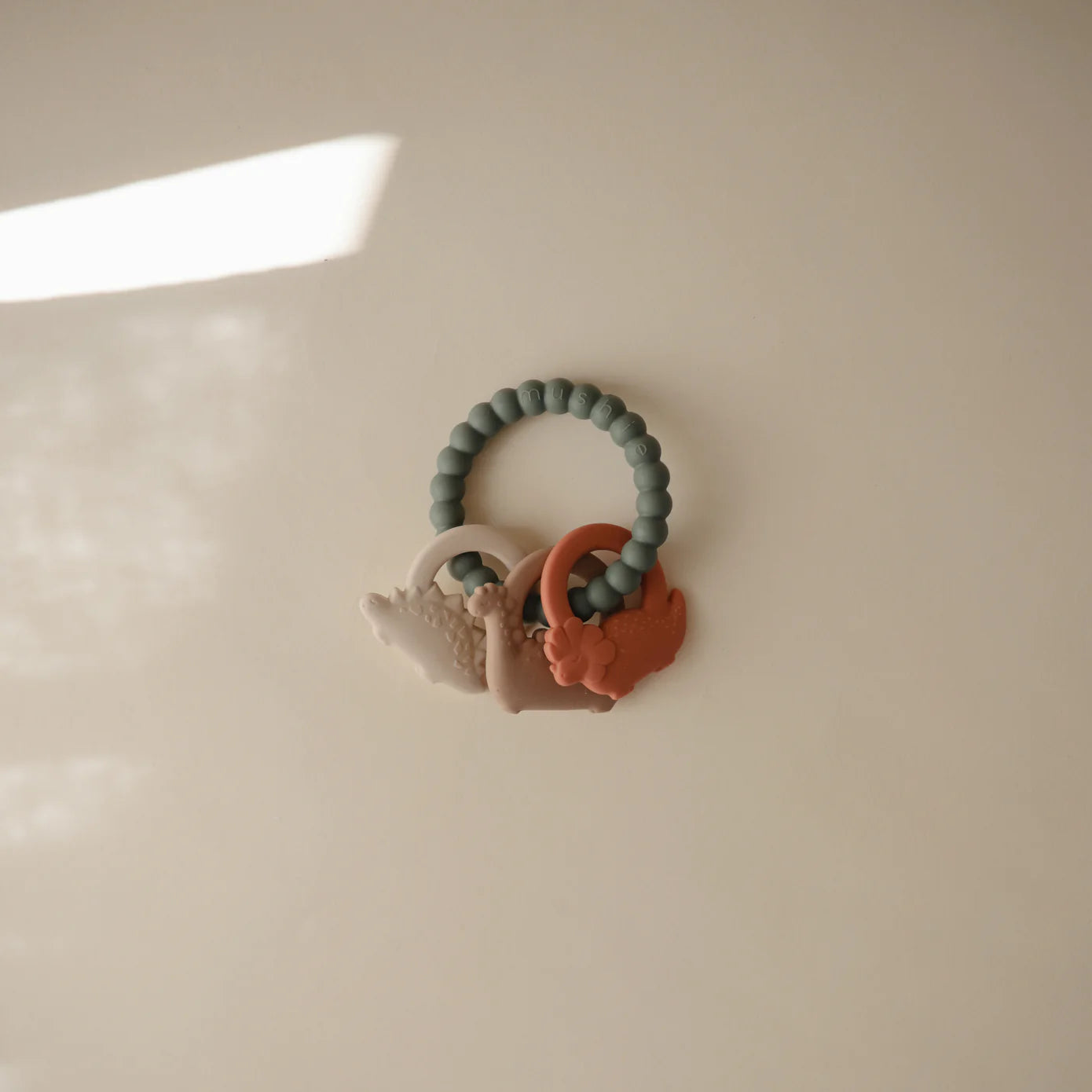 Mushie Silikona Graužamā Rotaļlieta - Dino